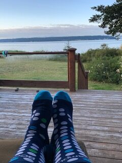 relaxed feet next to ocean